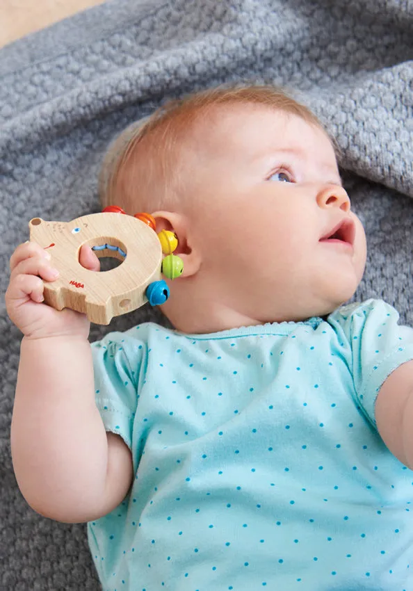 Clutching Toy Hedgehog Bells